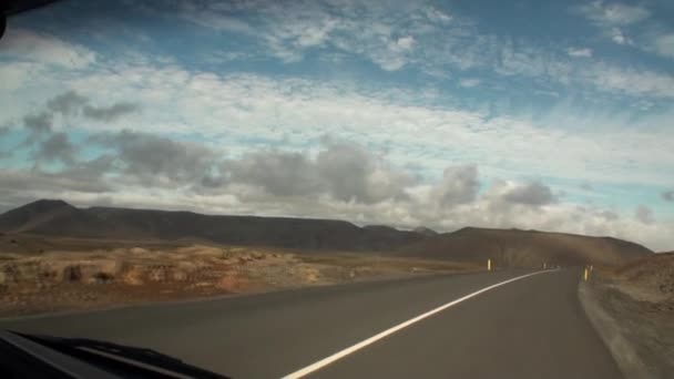 Road that leads to mountains on shore of Arctic Ocean in Greenland. — Stock Video