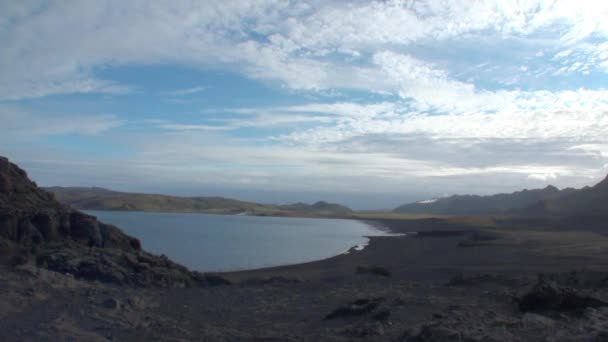 Lake in the mountains on shore of Arctic Ocean Greenland. — Stock Video