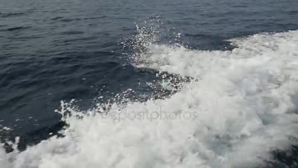 Waves from a motor boat against a background of the sea horizon in Indonesia. — Stock Video