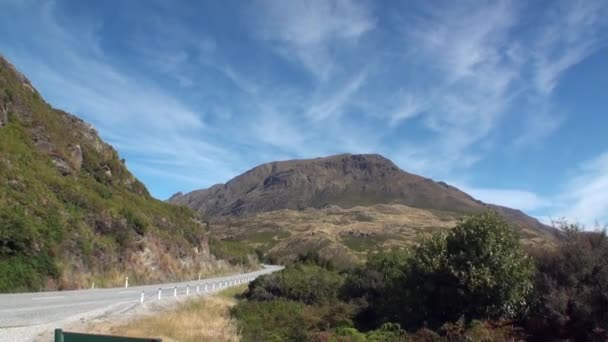 Road on ocean coast panorama view from car window in New Zealand. — Stock Video