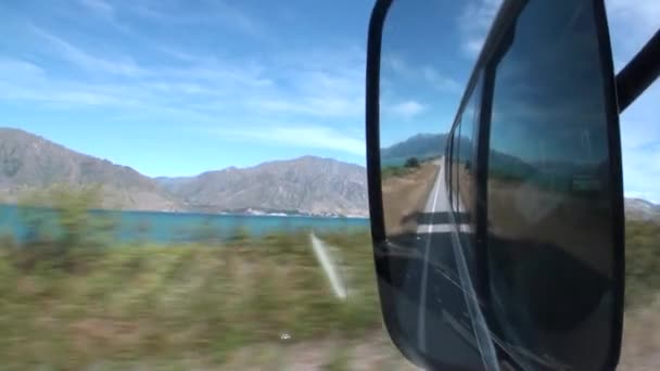 Road on ocean coast panorama view from car window in New Zealand. — Stock Video