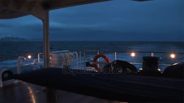 Back of ship at night on background of mountain on water of Arctic Ocean. — Stock Video