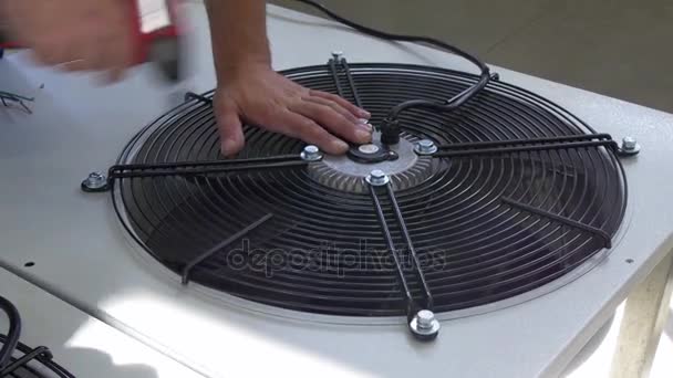 Hands of a worker make manufacture and repair of fans in factory. — Stock Video