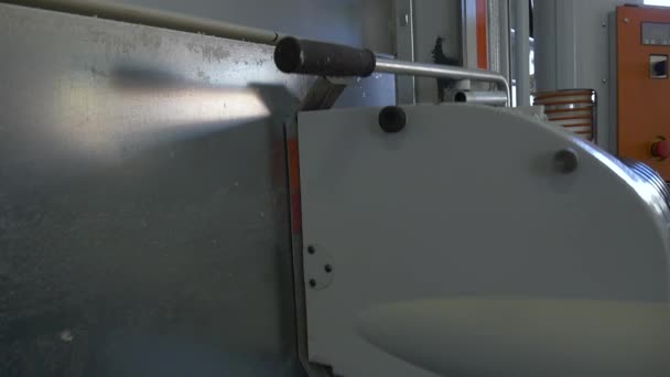 Cutting metal with circular saw by Industrial CNC machine slow motion.