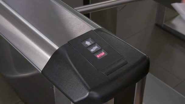 Hands of people apply electronic pass to turnstile wicket checkpoint in office. — Stock Video