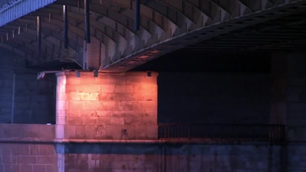 Lanterns illuminate from beneath on metal car bridge in evening Moscow. — Stock Video