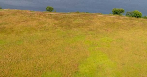 Arable landon Volga river aerial view from flying quadcopter over forest. — Stock Video