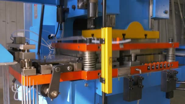 Cutting holes perforation stamping of metal sheets on industrial CNC machine. — Stock Video