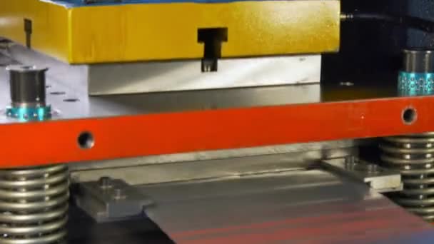 Cutting holes perforation stamping of metal sheets on industrial CNC machine. — Stock Video