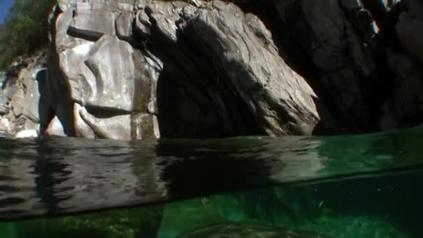 Underwater landscape of river Verzasca. on background of huge smooth stones. — Stock Video