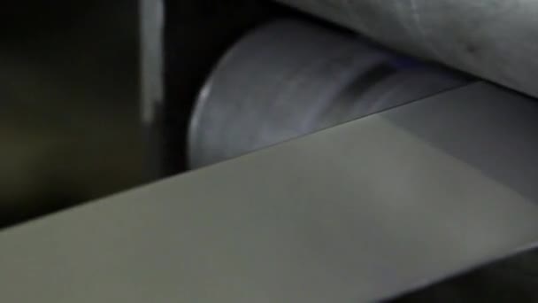 Close-up process of manufacturing strip of stainless steel on rolling machines. — Stock Video