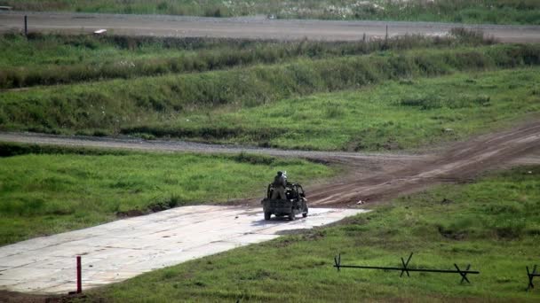 Russian buggy war military machine riding dusty road at exercises. — Stock Video