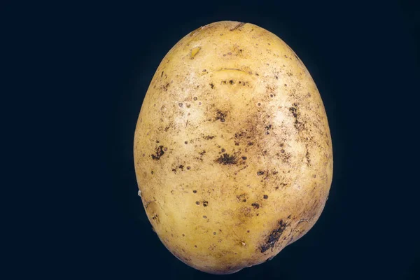 Potatoes on a black — Stock Photo, Image