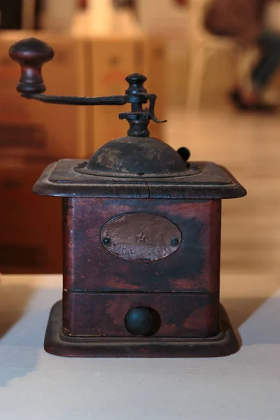 Antique Black Coffee Grinder on White Table — Stock Photo, Image