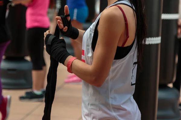 Girl Rolling Yellow Hand Wraps: Fitness and Boxing Workout — Stock Photo, Image