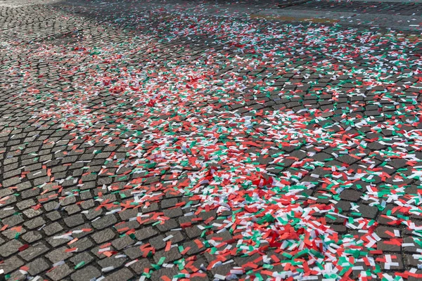 Colorful Confetti on Cobblestone Road in City Street — Stock Photo, Image