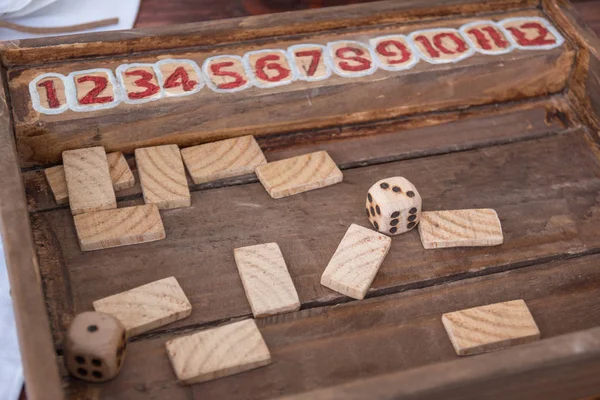 Antique Table Game with Dices and Rectangular Wooden Pieces on Board — Stock Photo, Image