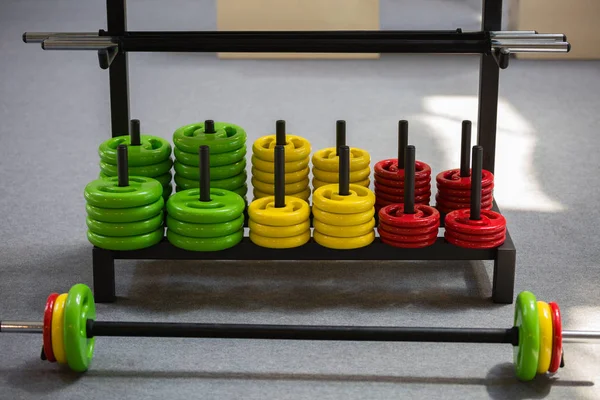 Weight Fitness Equipment: Colorful Disks and Barbell in Gym — Stock Photo, Image