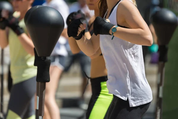 Rimini, Italy - june 2017:Fitness and Exercising Concept: Girls Workout with Speed Ball and Free Standing Boxing Punch Bag — Stock Photo, Image