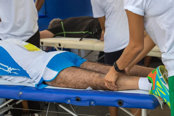 Parma, Italy - September 2017: Athlete 's Muscles Massage after Sport Workout — стоковое фото