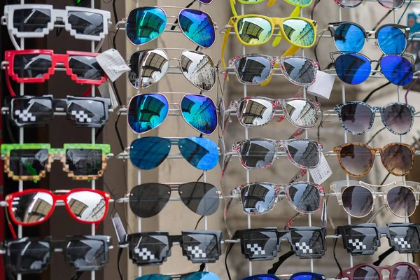 Hanging Sunglasses on Display in a Store — 스톡 사진