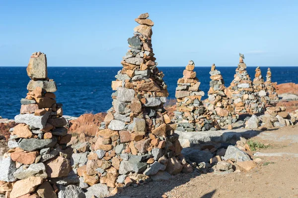 Stones Piled on Each Other near Coastline: Rocks and Cliffs near Sea.