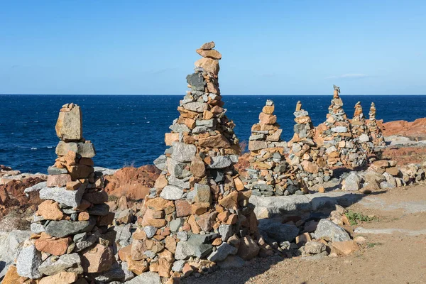 Stones Piled on Each Other near Coastline: Rocks and Cliffs near Sea.