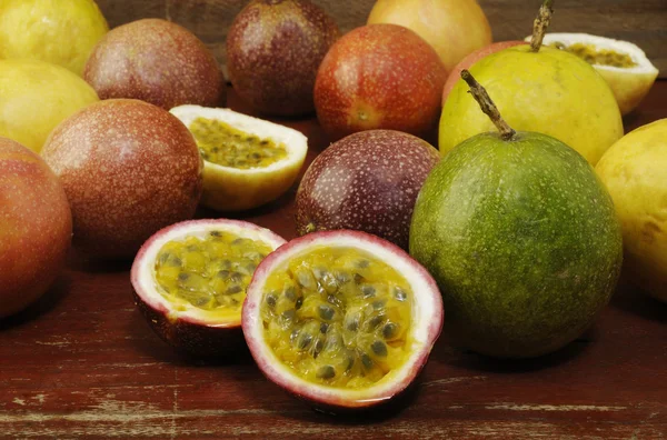 Passion fruits on wooden background — Stock Photo, Image