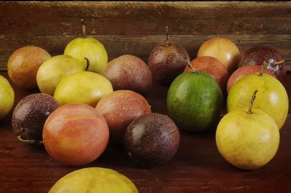 Passion fruits on wooden background — Stock Photo, Image