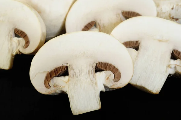 Fresh champignon mushrooms on wooden background — Stock Photo, Image