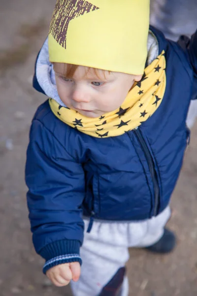 1 years old boy smiling in autumnal scenery Stock Photo