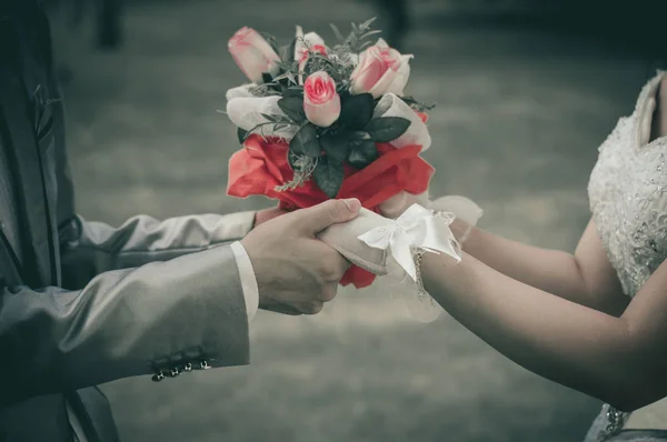 Flowers in hand — Stock Photo, Image