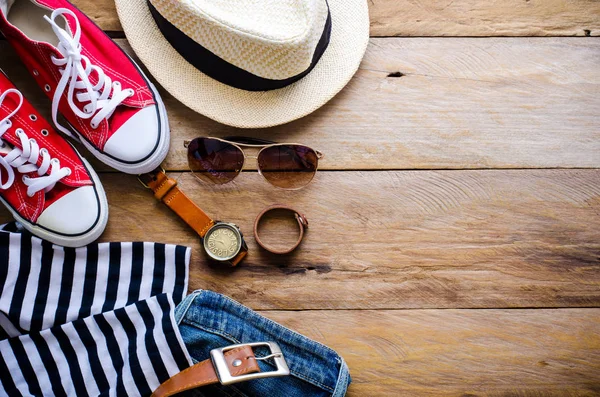 Clothing and accessories for women on wood floor — Stock Photo, Image