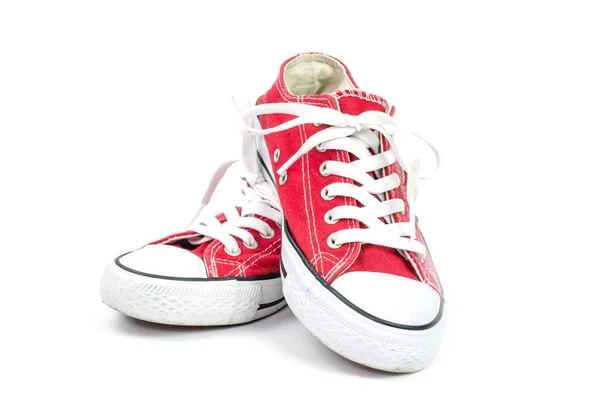 Red sneakers on a white background. — Stock Photo, Image