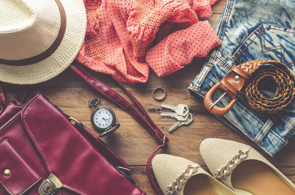 clothing for women, placed on a wooden floor.