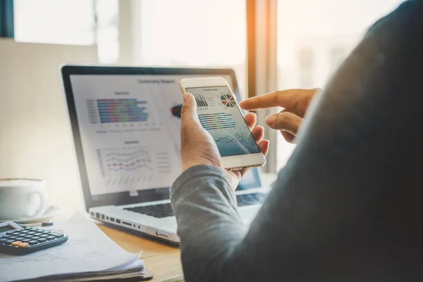 Businessmen use smartphones and laptop to connect and find infor — Stock Photo, Image