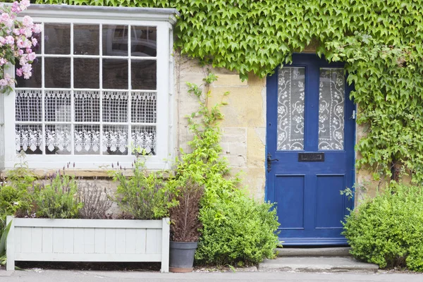 Blue doors in old stone house . — Stock Photo, Image