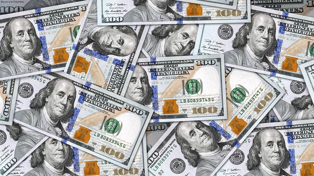 Close up banknote money background with lots of 100 US dollar bills