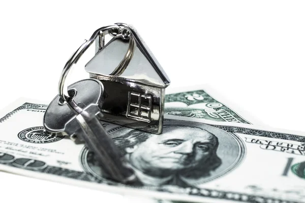 Amerikai dollárt kép, ami a legfontosabb, a ház formájában távirányítóval, képviseli a vétel vagy eladás ingatlan és a ház — Stock Fotó