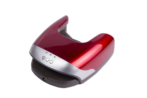 Red manicure gel curing lamp isolated on white