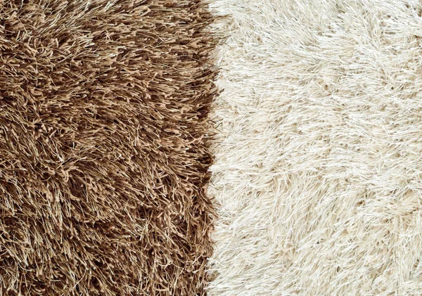 Brown and white hairy carpets divide in half — Stock Photo, Image