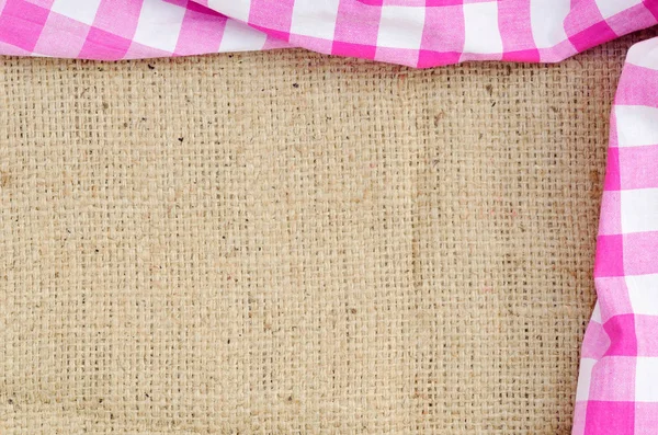 Purple folded checkered rural tablecloth over canvas - frame — Stock Photo, Image