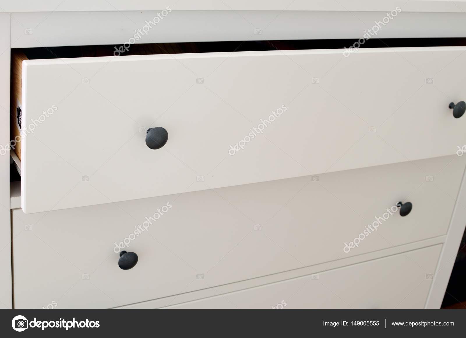 Detail Of Drawers Of Modern White Laminate Dresser Stock