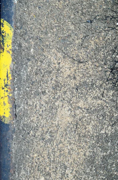 Texture of concrete with a yellow and black stripes — Stock Photo, Image