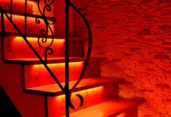 Red night LED lighting wooden stairs — Stock Photo, Image