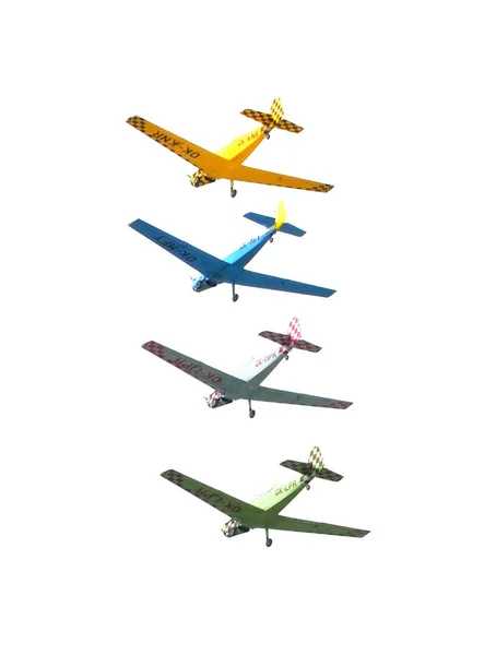 Four airplanes during aerobatic flying airshow isolated on white background. — Stock Photo, Image