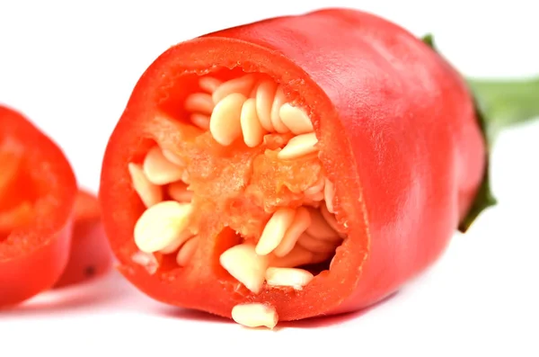 Half pieced chilli pepper with seeds isolated on white background. — 스톡 사진
