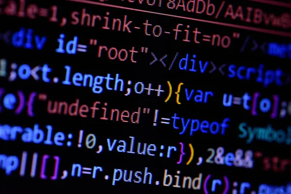 Macro of minified javascript file. Computer programming source code for HTML website development. — Stock Photo, Image