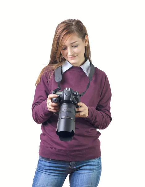 Attractive female photographer holding a professional camera — Stock Photo, Image