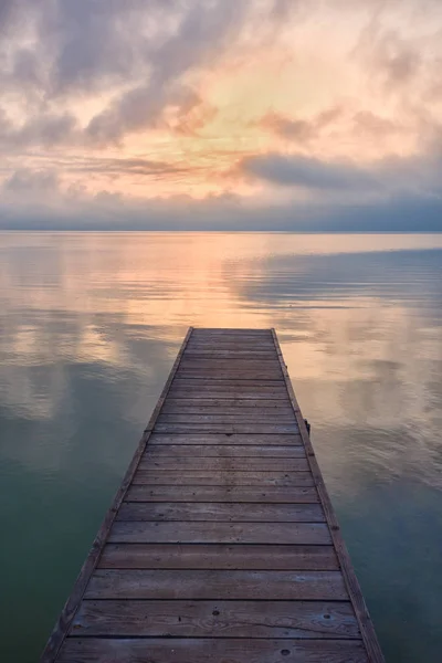 Wooden pier in the sunset — Stock Photo, Image